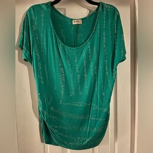 Green short sleeve top with cinched sides and silver sparkly detail on front